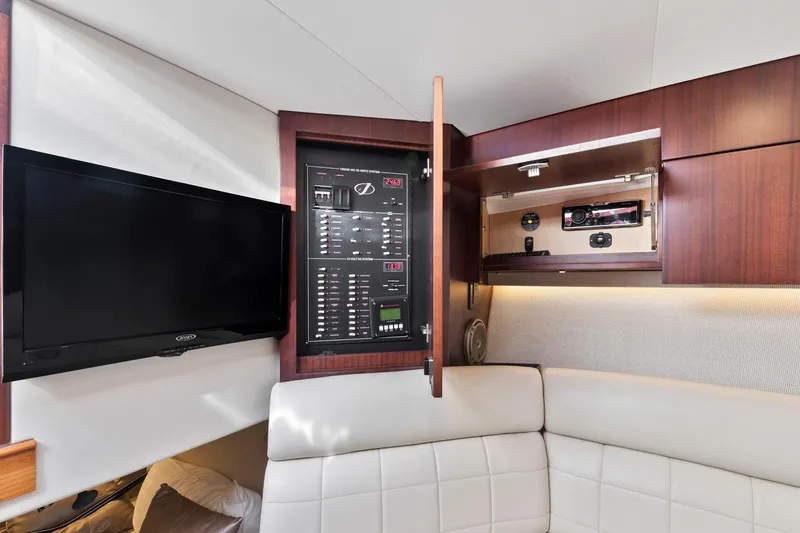 Slide: The Image of Control panel and TV in the cabin of a 2017 Jupiter 41SB boat. - 12