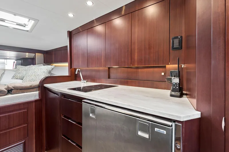 Slide: The Image of Luxurious kitchen area in a 2017 Jupiter 41SB yacht with modern appliances. - 13