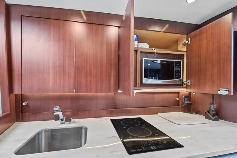 Slide: The Image of Modern kitchen in 2017 Jupiter 41SB yacht with sink, stovetop, and microwave. - 14