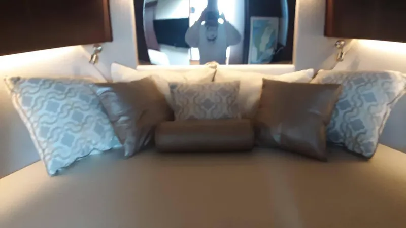Slide: The Image of Luxurious 2017 Jupiter 41SB yacht cabin with elegant pillows and ambient lighting. - 16