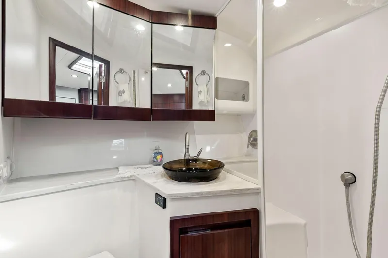 Slide: The Image of Luxurious bathroom in 2017 Jupiter 41SB yacht with modern fixtures and elegant design. - 18