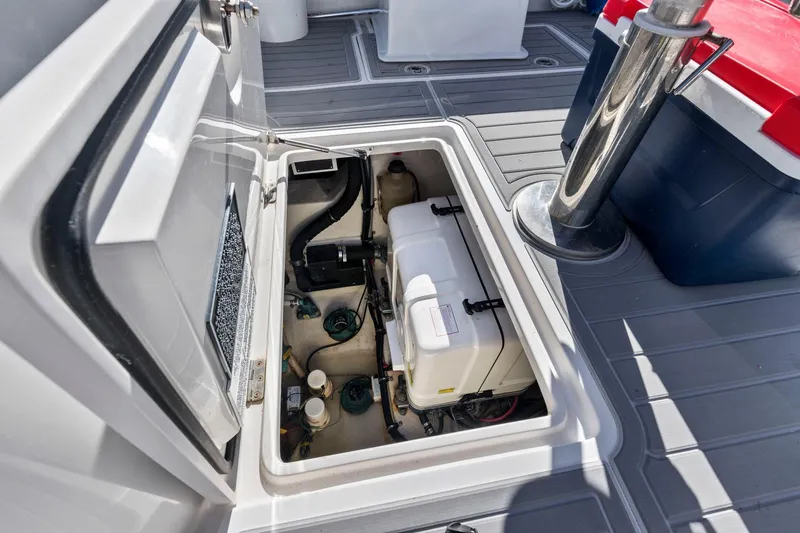 Slide: The Image of Open hatch of a 2017 Jupiter 41SB boat showing internal components. - 22