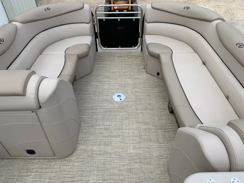 Slide: The Image of 2015 Avalon Ambassador Rear J Lounge boat interior with beige seating and carpet. - 12