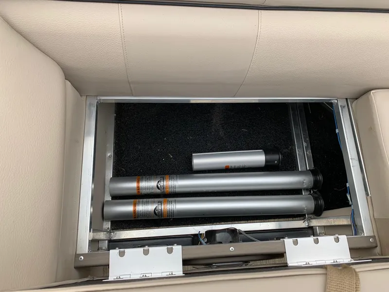 Slide: The Image of Storage compartment in 2015 Avalon Ambassador Rear J Lounge boat with metal tubes. - 15