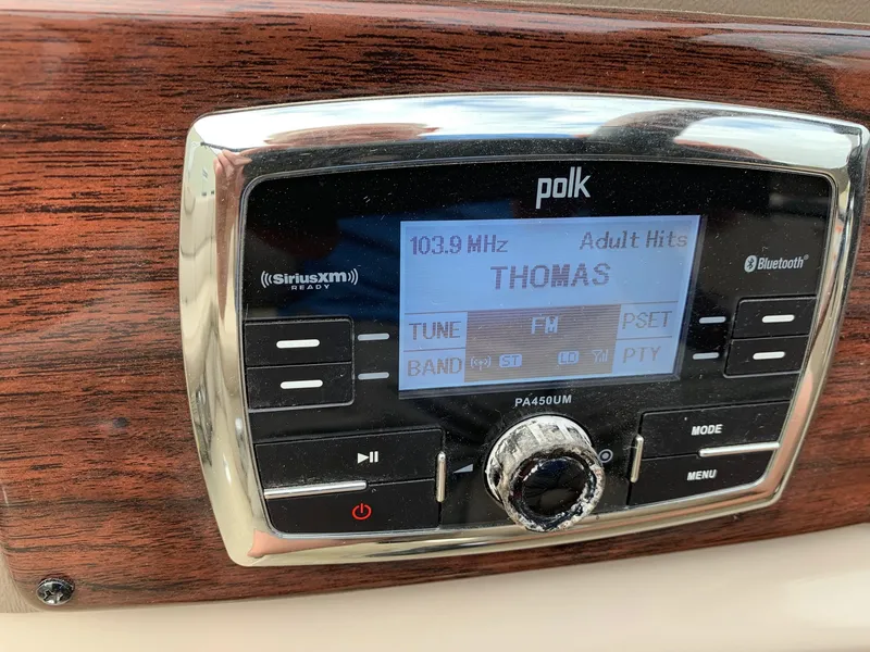 Slide: The Image of Polk audio system in 2015 Avalon Ambassador boat, displaying FM radio station. - 18
