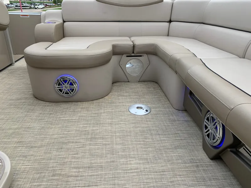 Slide: The Image of 2015 Avalon Ambassador Rear J Lounge interior with beige seating and built-in speakers. - 21