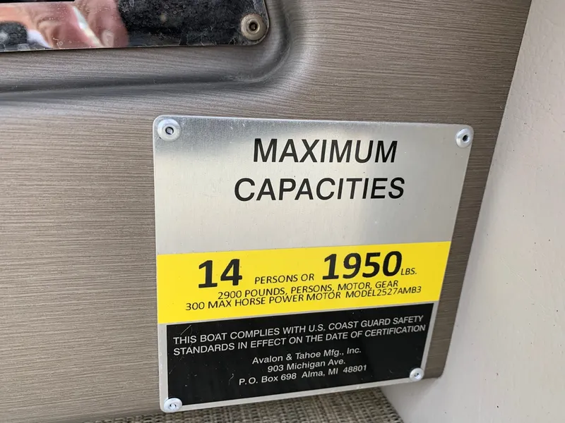 Slide: The Image of Capacity plate on 2015 Avalon Ambassador boat, max 14 people or 1950 lbs. - 23