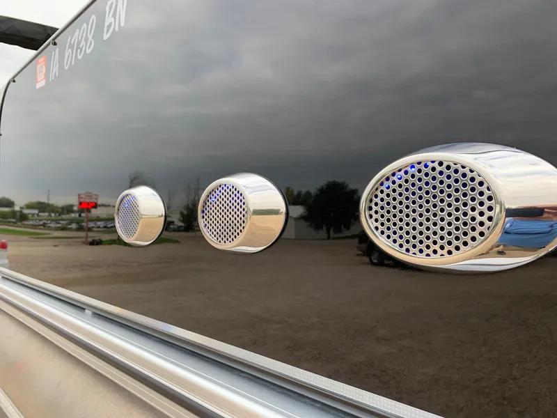 Slide: The Image of Close-up of chrome speakers on a 2015 Avalon Ambassador Rear J Lounge boat. - 24