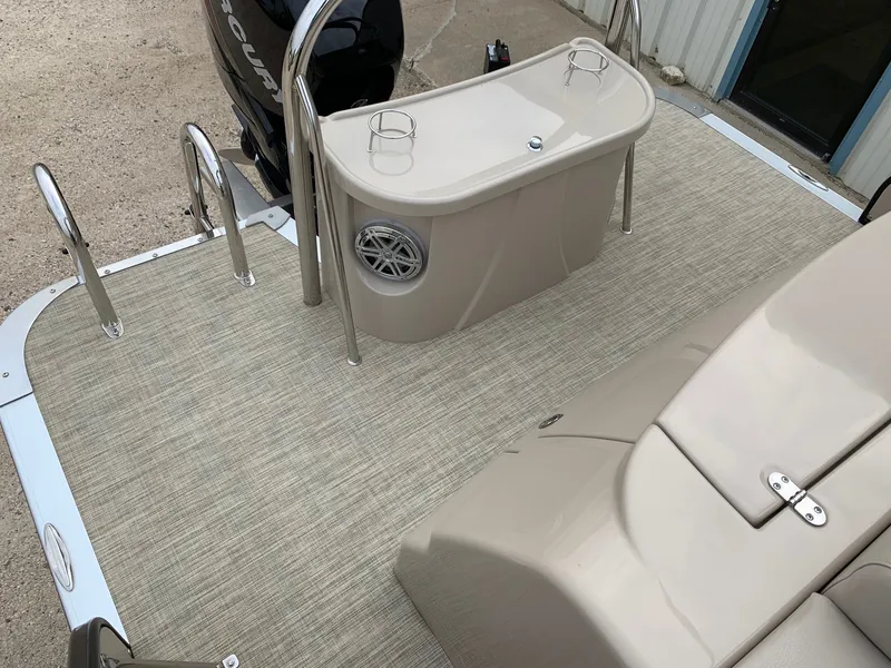 Slide: The Image of 2015 Avalon Ambassador Rear J Lounge boat deck with seating and motor. - 30