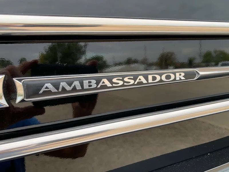 Slide: The Image of Close-up of 2015 Avalon Ambassador logo on a sleek black surface. - 7