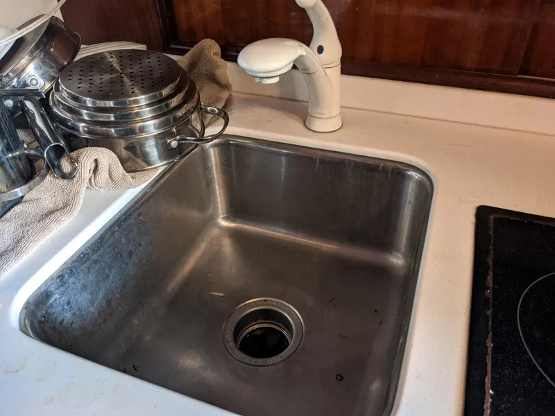 Slide: The Image of Stainless steel sink in 1977 Hatteras 46 Convertible yacht kitchen. - 23