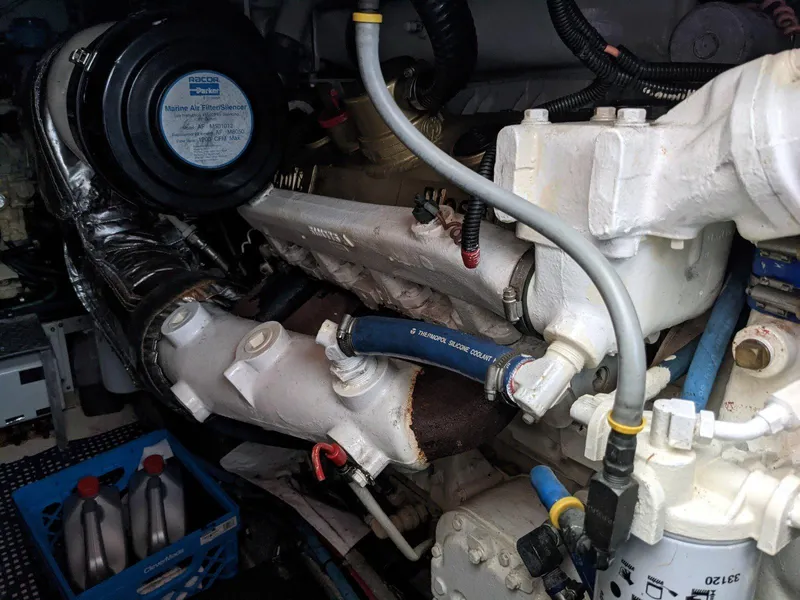 Slide: The Image of Engine compartment of a 1977 Hatteras 46 Convertible boat, showcasing mechanical components. - 42