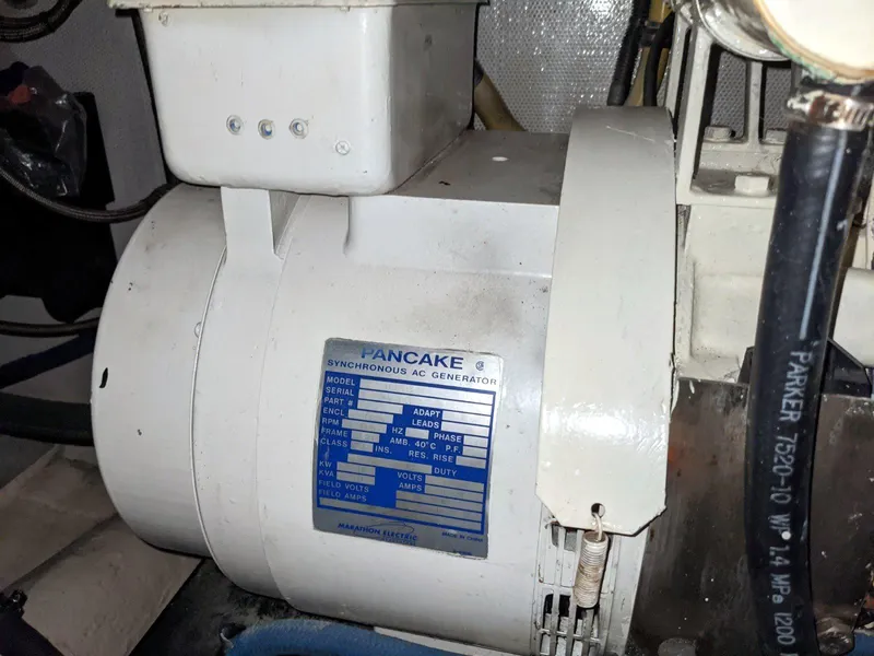 Slide: The Image of 1977 Hatteras 46 Convertible engine room with Pancake synchronous AC generator. - 32