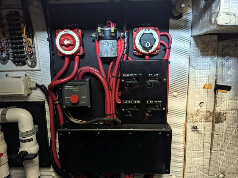 Slide: The Image of Electrical panel of a 1977 Hatteras 46 Convertible boat with switches and wiring. - 37