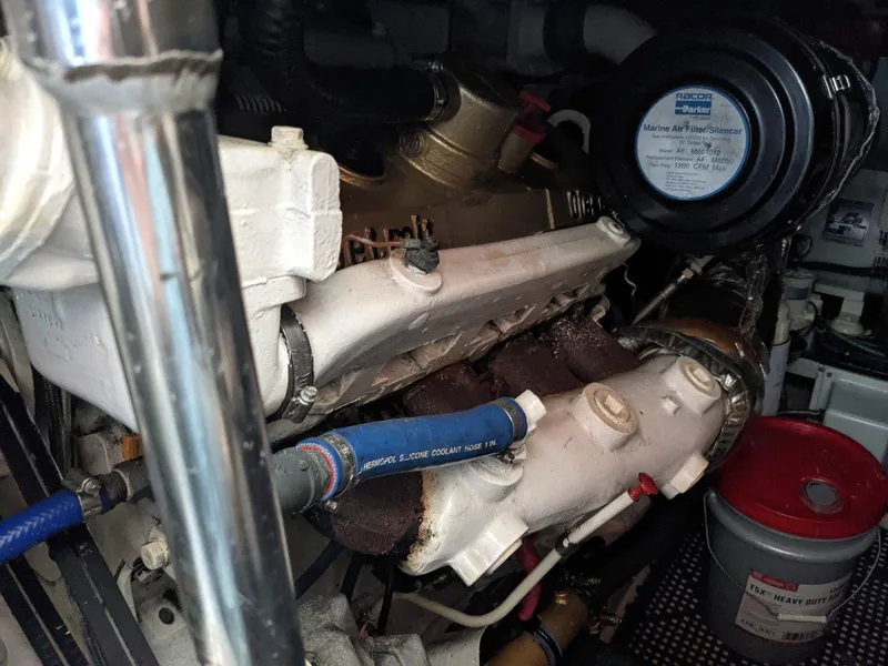 Slide: The Image of Engine compartment of a 1977 Hatteras 46 Convertible boat, showing mechanical components. - 41