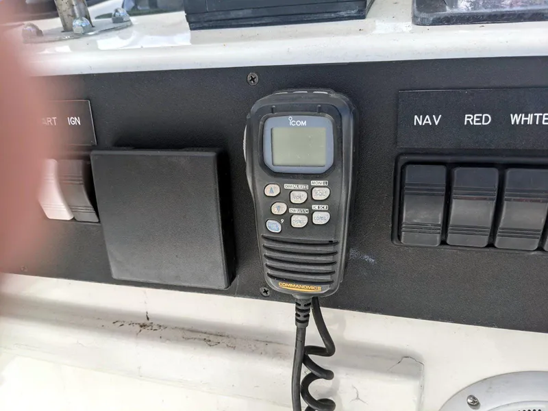 Slide: The Image of Control panel of a 1977 Hatteras 46 Convertible with radio and switches. - 6