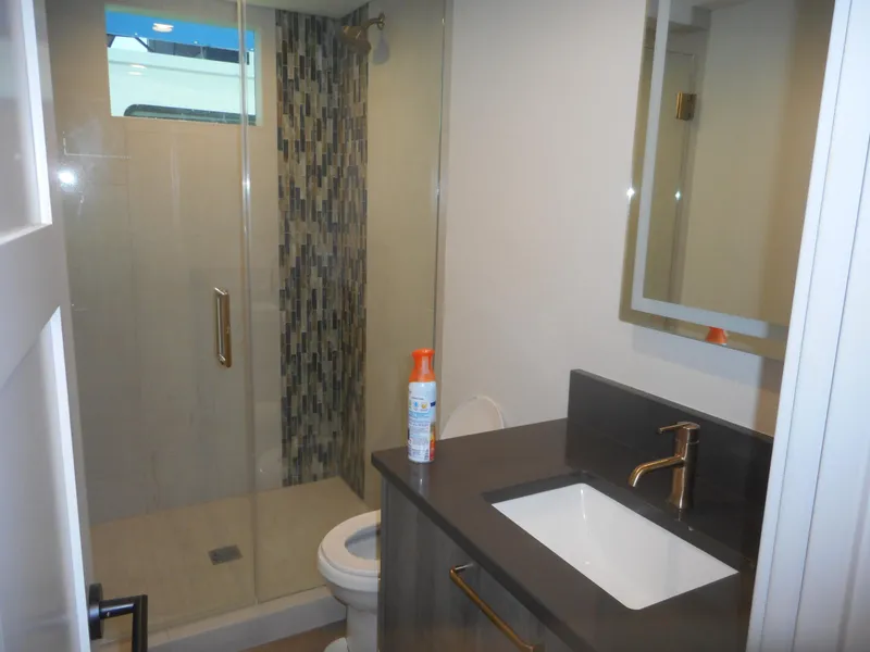 Slide: The Image of Modern bathroom in Adonia Melody Share #12, 2021, featuring glass shower and sleek vanity. - 22