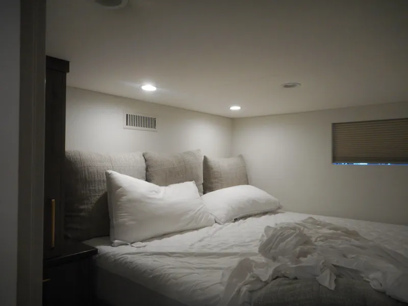 Slide: The Image of Cozy bedroom interior in Adonia Melody Share #12, 2021 model, with soft lighting and plush bedding. - 23