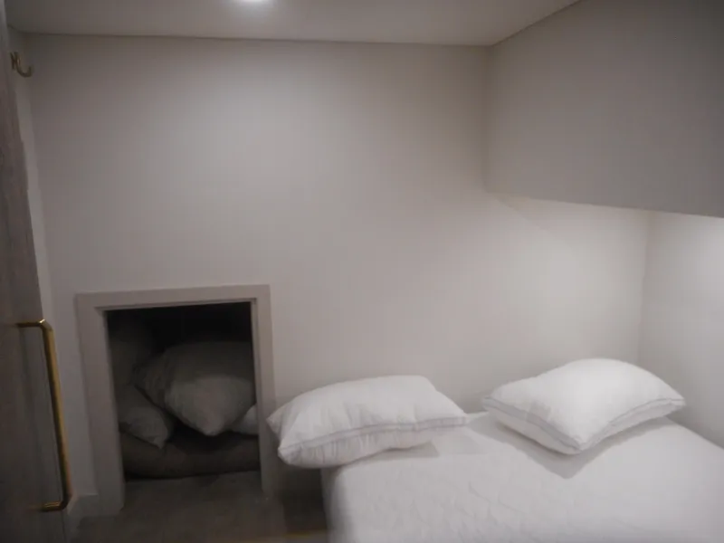 Slide: The Image of Minimalist bedroom with white bedding, small storage nook, Adonia Melody Share #12, 2021. - 28