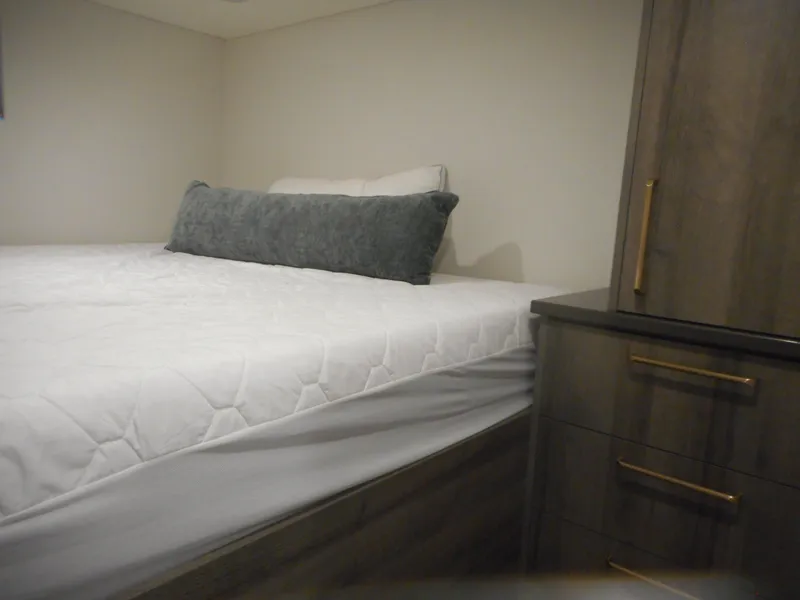 Slide: The Image of Bedroom interior of Adonia Melody Share #12, 2021 model, featuring a neatly made bed and wooden dresser. - 31