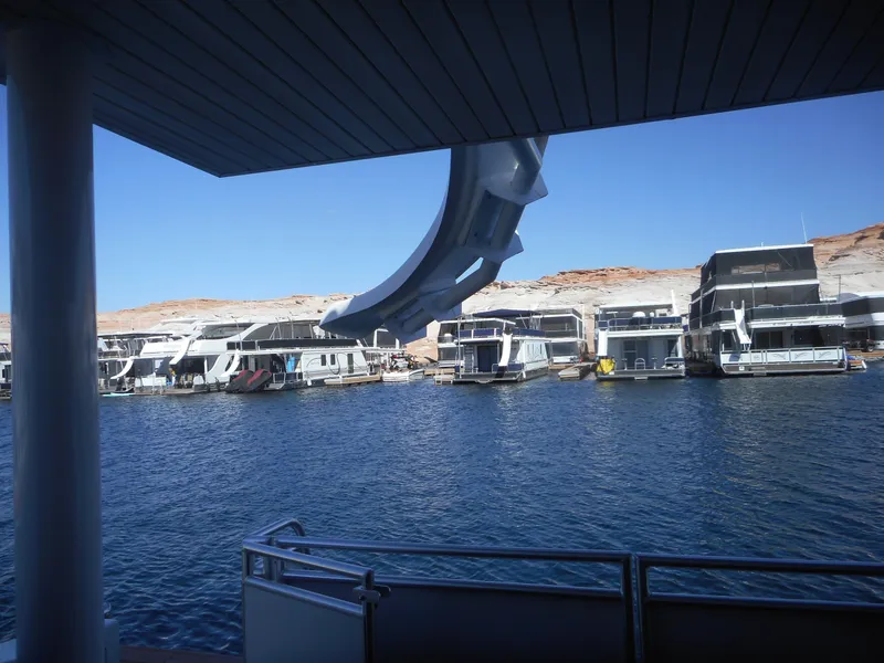 Slide: The Image of Houseboats docked on a serene lake, viewed from Adonia Melody Share #12, 2021 model. - 45