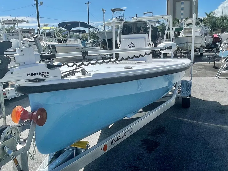 Slide: The Image of 2025 Piranha Magro P180 boat on trailer, featuring Minn Kota trolling motor. - 1