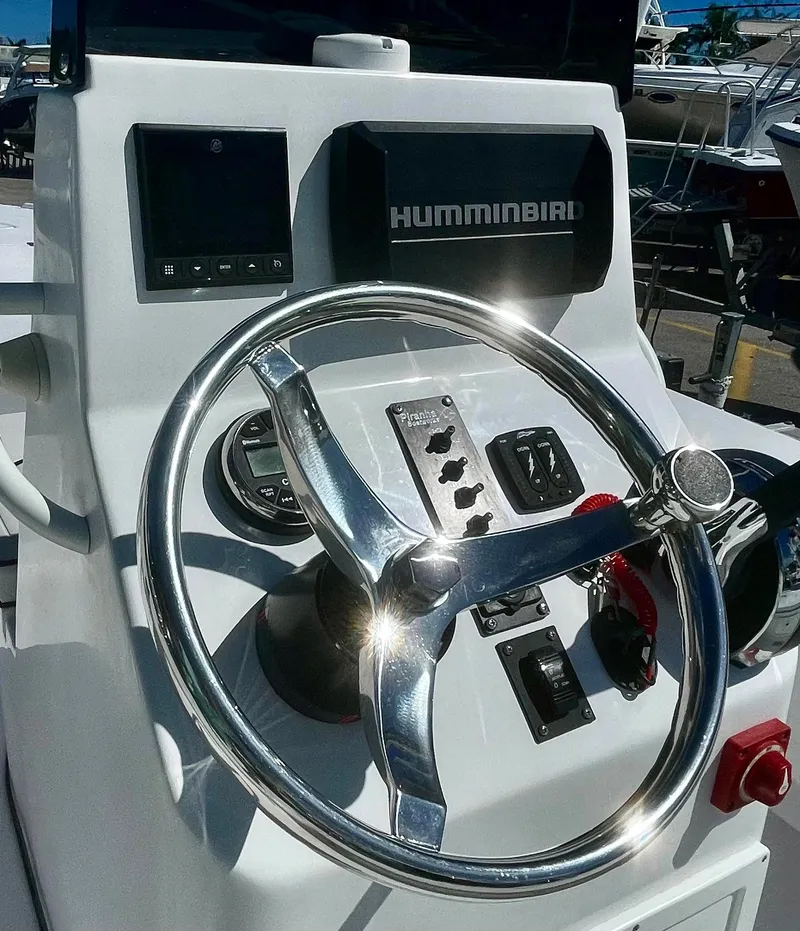 Slide: The Image of Steering console of 2025 Piranha Magro P180 boat with Humminbird electronics. - 12