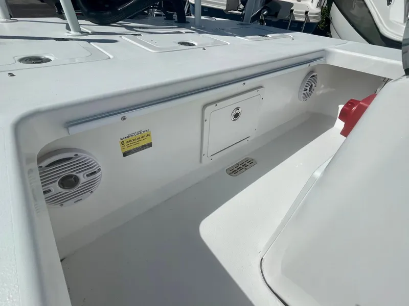 Slide: The Image of 2025 Piranha Magro P180 boat interior with speakers and storage compartment. - 15