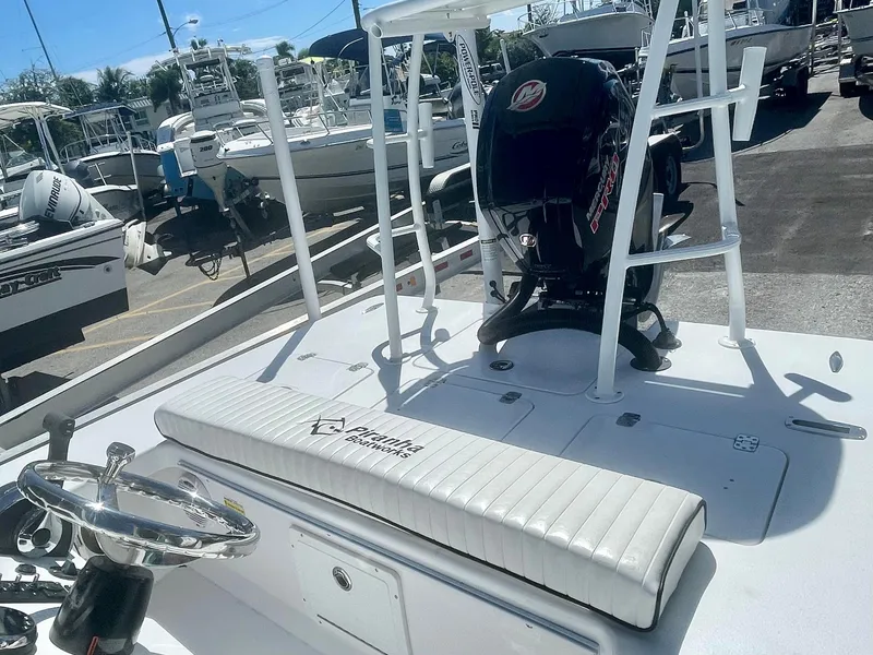 Slide: The Image of 2025 Piranha Magro P180 boat with outboard motor, docked in a marina. - 7