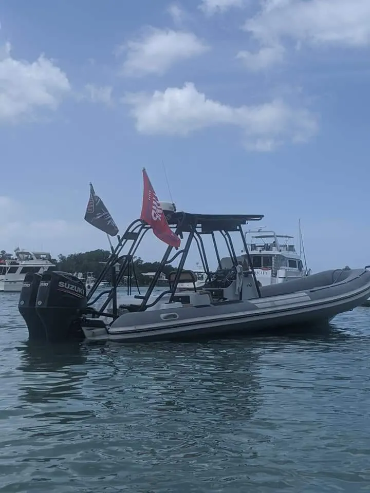 Slide: The Image of 2005 Nautica WIDE BODY boat parked in wooded area. - 2