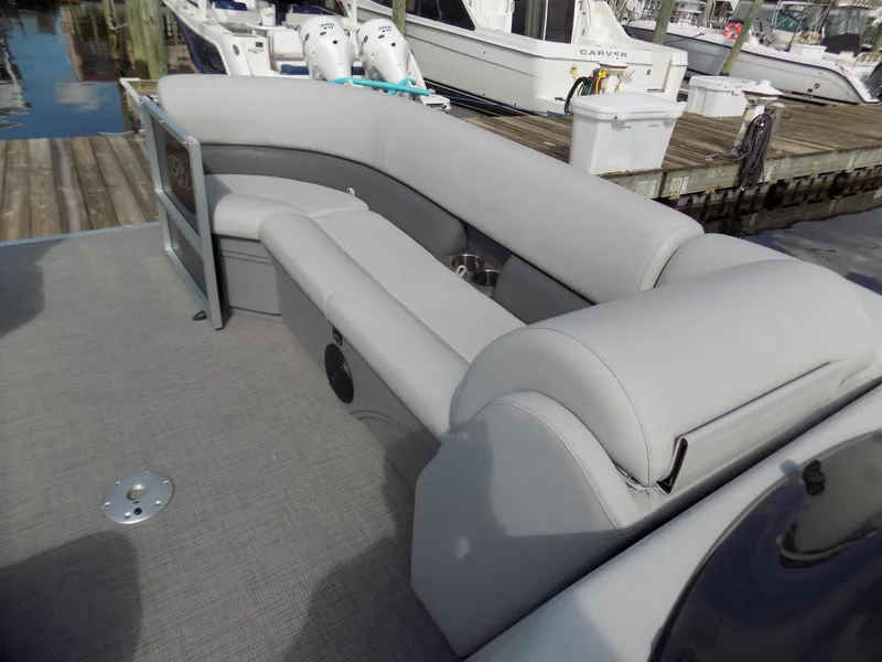 Slide: The Image of 2021 Bentley Pontoons 240 CRUISE with gray seating at a marina dock. - 4