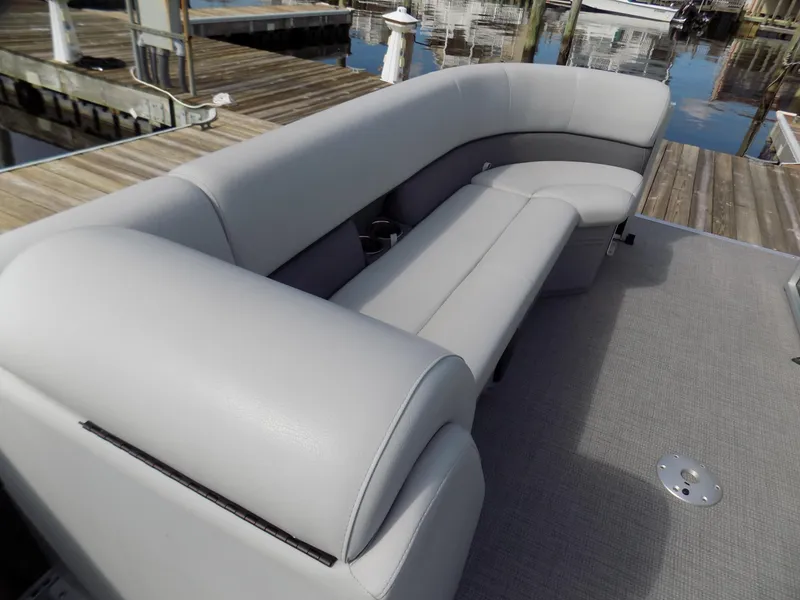 Slide: The Image of 2021 Bentley Pontoons 240 CRUISE with gray seating on a docked pontoon boat. - 5
