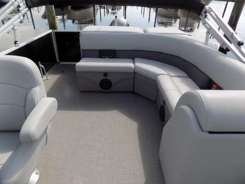 Slide: The Image of 2021 Bentley Pontoons 240 CRUISE interior with gray seating and carpeted floor. - 6