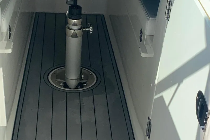 Slide: The Image of 2022 Cobia 240 DC boat interior with sleek flooring and sturdy fixtures. - 20