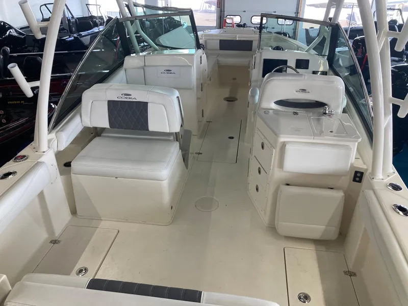 Slide: The Image of 2022 Cobia 240 DC boat interior with seating and storage compartments. - 21