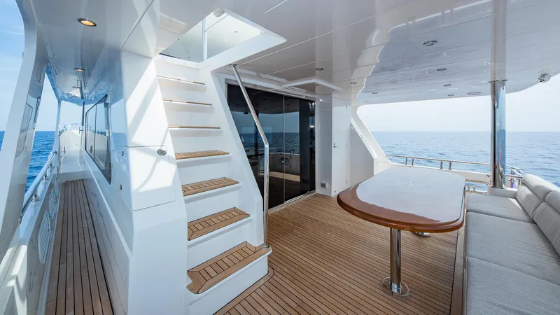 Slide: The Image of Hampton 680 ENDURANCE LRC 2027 yacht deck with stairs and ocean view. - 13