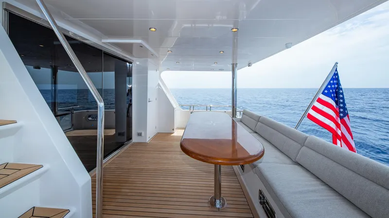 Slide: The Image of Hampton 680 ENDURANCE LRC 2027 yacht with deck and American flag. - 9