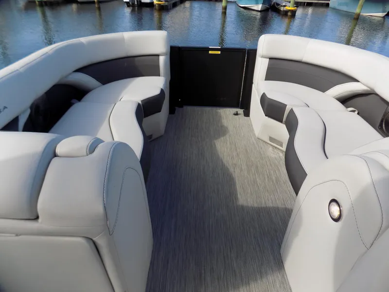 Slide: The Image of 2021 Barletta Corsa 23U pontoon boat interior with plush seating and modern design. - 10