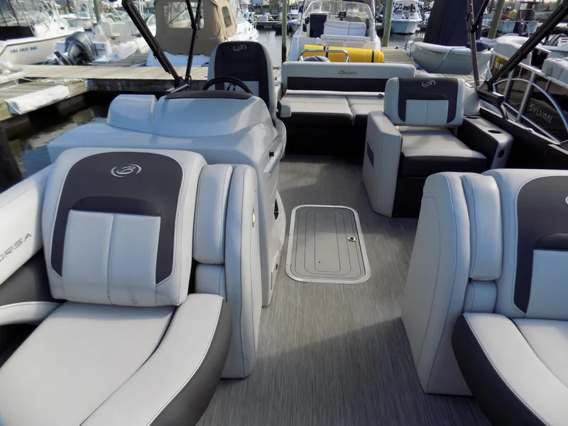 Slide: The Image of 2021 Barletta Corsa 23U pontoon boat interior with plush seating and modern design. - 11