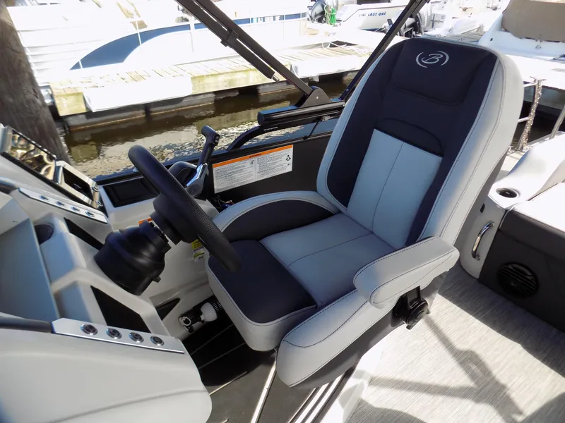 Slide: The Image of Captain's seat on 2021 Barletta Corsa 23U boat, featuring sleek design and modern controls. - 8