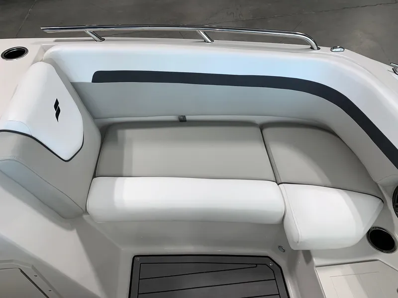 Slide: The Image of 2024 Starcraft SVX 210 boat interior seating with white and gray upholstery. - 11
