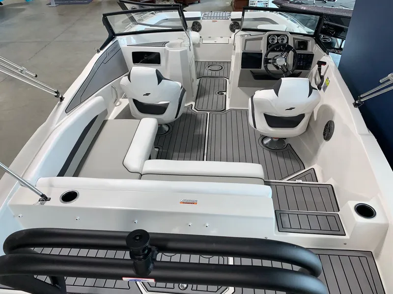 Slide: The Image of 2024 Starcraft SVX 210 boat interior with modern seating and dashboard. - 13