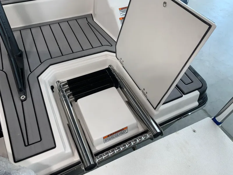 Slide: The Image of 2024 Starcraft SVX 210 boat with integrated swim ladder. - 14