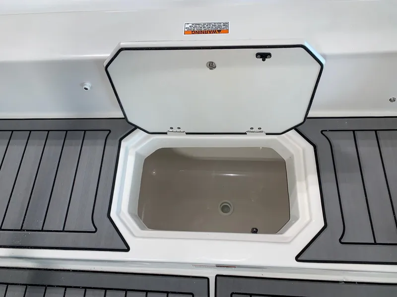 Slide: The Image of 2024 Starcraft SVX 210 boat storage compartment with open hatch. - 16