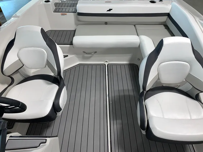 Slide: The Image of 2024 Starcraft SVX 210 boat interior with white and black seating. - 3
