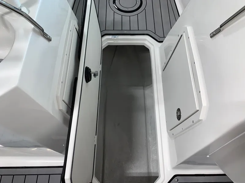 Slide: The Image of 2024 Starcraft SVX 210 boat storage compartment with open hatch. - 7