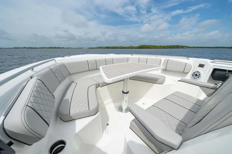 Slide: The Image of Luxurious seating area on the 2025 Pursuit S 358 boat with ocean view. - 10