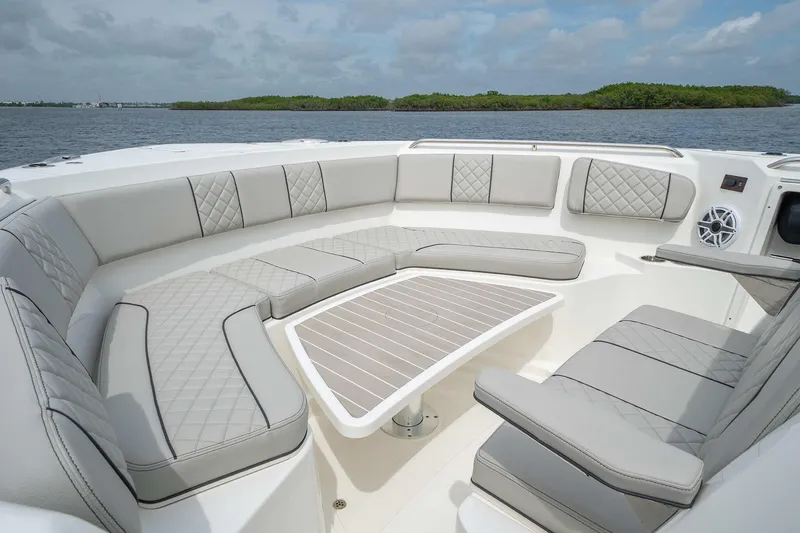 Slide: The Image of Luxurious seating area on the 2025 Pursuit S 358 boat with scenic water view. - 11