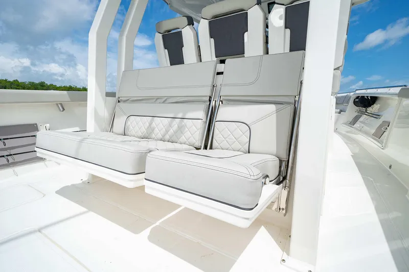 Slide: The Image of 2025 Pursuit S 358 boat with luxurious white seating and modern design. - 19