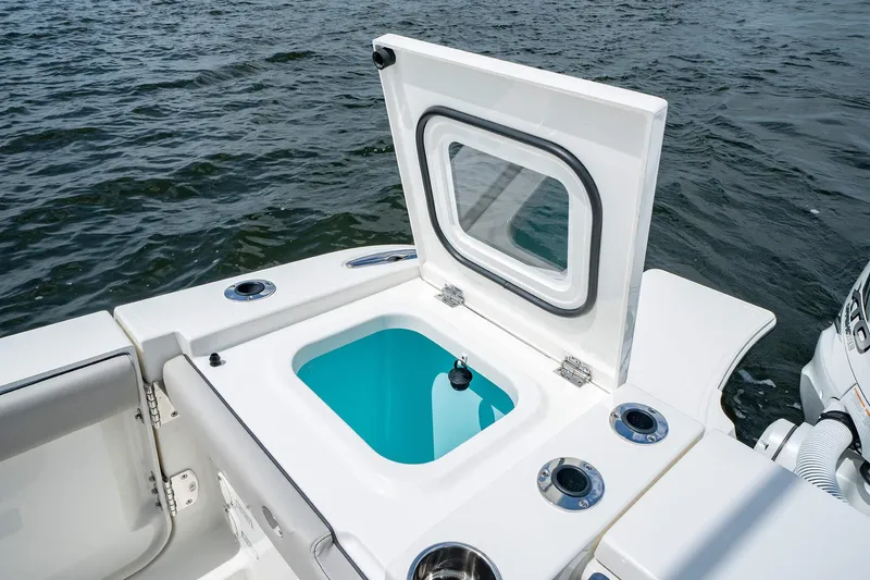 Slide: The Image of 2025 Pursuit S 358 boat with open livewell on deck. - 21